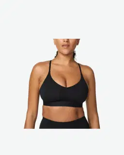 Sostén ajustable acolchado de sujeción ligera Nike Indy Mujer – 1/4