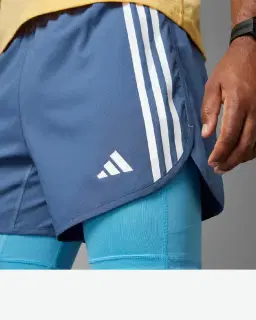 Pantalones cortos Adidas 2-en-1 Own The Run 3 Rayas Hombre – 3/4
